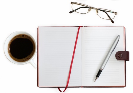 cup of coffee, notebook and glasses on white background の写真素材