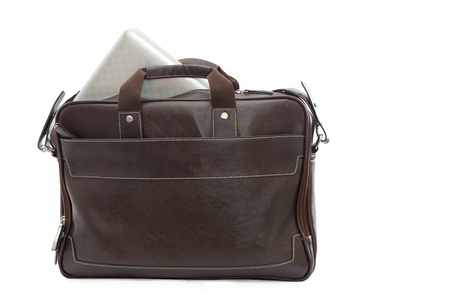 brown bag with computer over white background の写真素材
