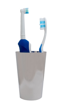 electric toothbrush and usual toothbrush over white backgroundの写真素材