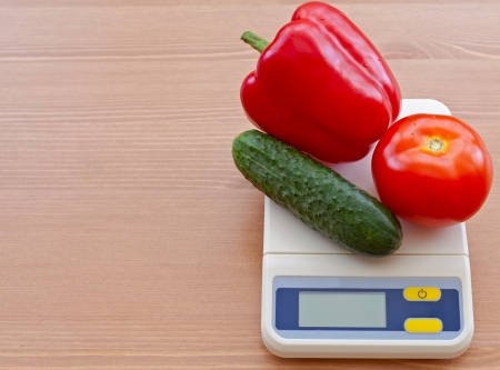 vegetables on electronic scale の写真素材