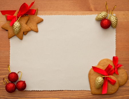 old paper with christmas cookies and decorationsの写真素材