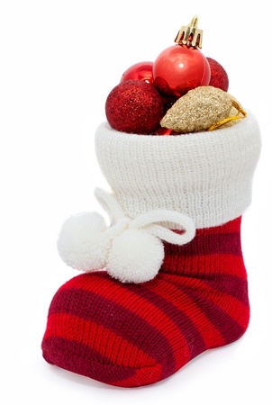christmas stocking with decorations isolated on whiteの写真素材