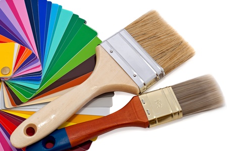 paintbrushes and color samples over white backgroundの写真素材