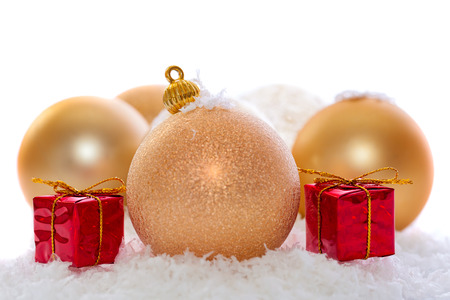 gold christmas decorations isolated on whiteの写真素材