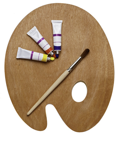 palette, paints and paint brush isolated over whiteの写真素材