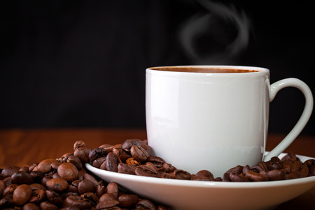 cup of coffee against dark backgroundの写真素材