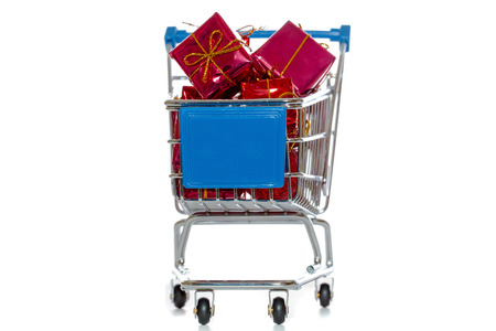 Shopping cart with presents isolated over whiteの写真素材