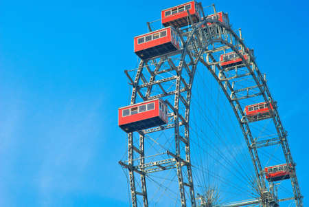 Observation wheel on the blue background of sky