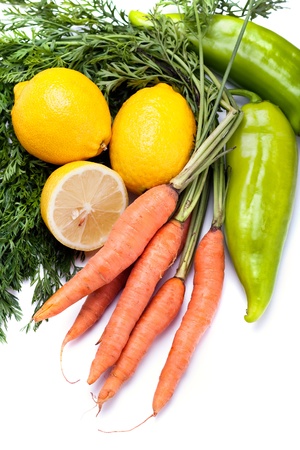 Carrots, green pepper and lemonsの写真素材