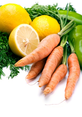 Carrots, green pepper and lemonsの写真素材