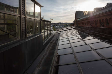 Fragments of buildings and roofs in the city of Helsinki, evening time. High quality photoの写真素材