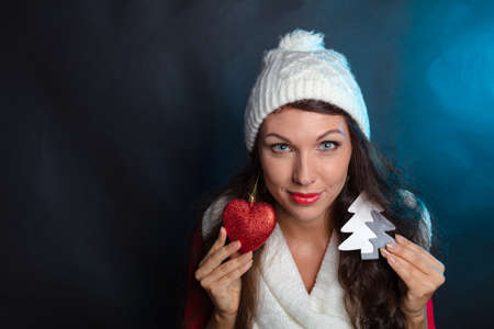 Cheerful, beautiful brunette with a large box, a gift for the New Year. Congratulation. High quality photoの写真素材