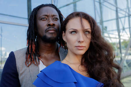 Close-up portrait, outdoors. mixed couple, African and European Caucasian. High quality photoの写真素材