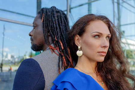 Close-up portrait, outdoors. mixed couple, African and European Caucasian. High quality photoの写真素材
