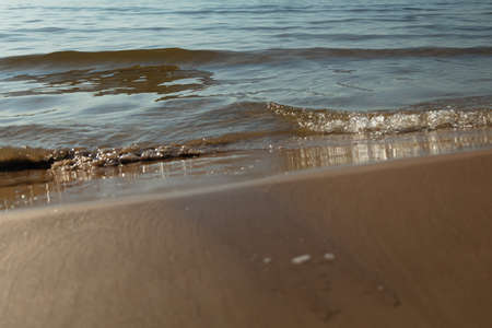 Sandy beach and gentle, soft wave, Baltic nature. High quality photo