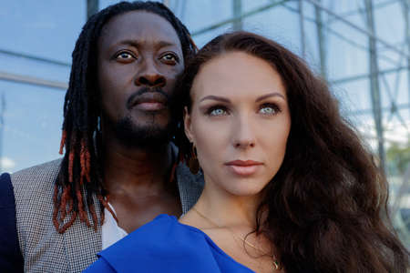 Close-up portrait, outdoors. mixed couple, African and European Caucasian. High quality photo