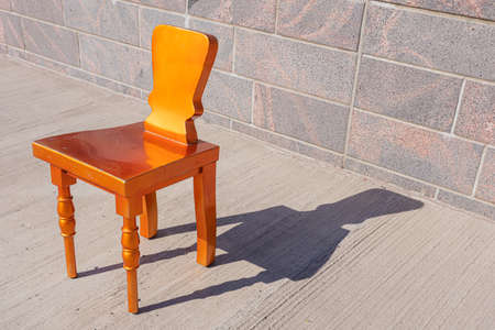 Golden chair in the street. Public bench. High quality photoの写真素材