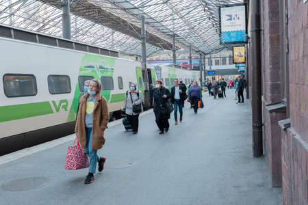 Helsinki, Uusimaa, Finland 2020 October 2, 2020 At the railway station, people at the electric train...