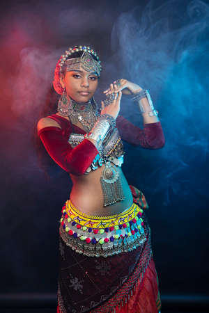 Belly dancer, Indian and flamenco dancer. Ancient prefab costumes are multi-layered Indian skirts, Afghan, Yemeni antique jewelry, many colors, iron and wealth. High quality photoの写真素材