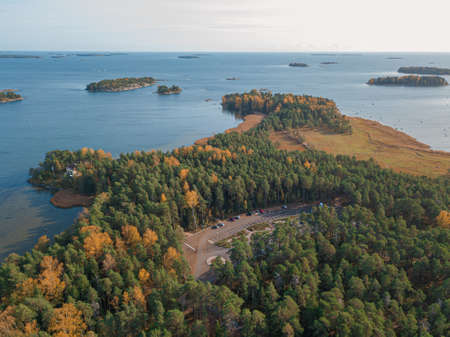 The coastline of the Gulf of Finland and an island in the sea Helsinki, Vuosaari .. Sunny autumn day. Nature and landscape of Scandinavia. Aerial photo from drone. High quality photoの写真素材