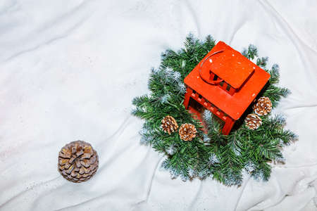 Christmas wreath and red flashlight on a white background Conceptual meeting, Happy New Year greetings. High quality photoの写真素材