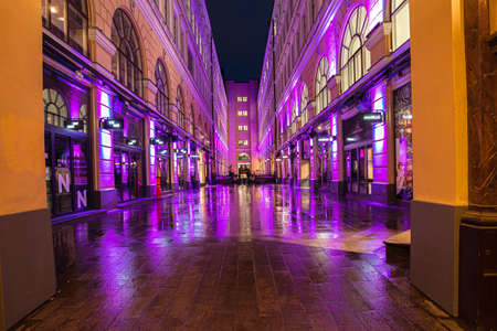 Helsinki, Finland November 30, 2020 Old town streets in the evening, decorated for Christmas, after the rain. Burning lights and reflections. High quality photoのeditorial素材