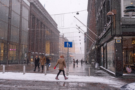 Helsinki, Finland. January 12, 2021. Medieval Scandinavian Architecture. Winter, city landscape, people. Heavy snow is falling. Panorama of the city. High quality photoのeditorial素材