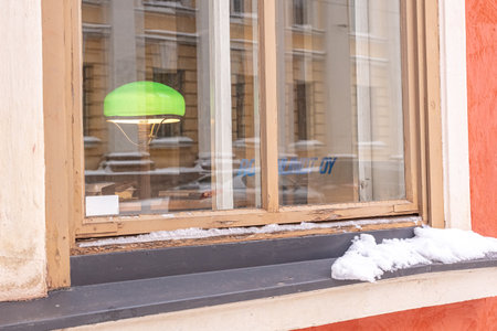 Finland, Helsinki. January 26, 2021 Windows and facade of an old building in Helsinki. close-up. High quality photoのeditorial素材