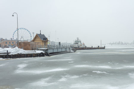 Finland, Helsinki. January 26, 2021 Helsinki embankment in winter, frozen sea. High quality photoのeditorial素材
