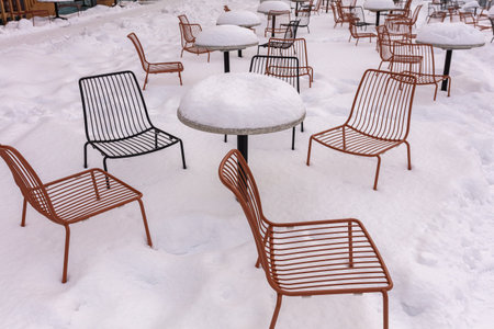 Metal chairs outside under a heavy snow. High quality photoの写真素材
