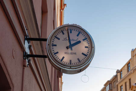 Antique round clock on the wall, Ulyanina, Helsinki Finland. High quality photoのeditorial素材