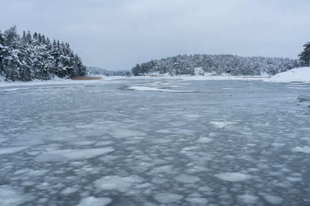 Gulf of Finland in winter, between islands, ice floes on the sea. High quality photo