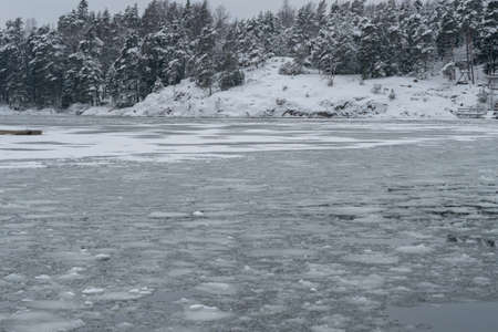 Gulf of Finland in winter, between islands, ice floes on the sea. High quality photo