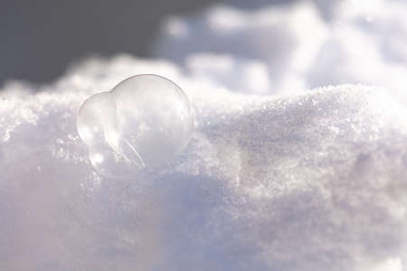 soap bubbles frozen lie in the snow. High quality photoの写真素材