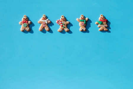 Gingerbread on a blue background. Concept for christmas, new year 2022, winter. Have place for text. High quality photoの写真素材