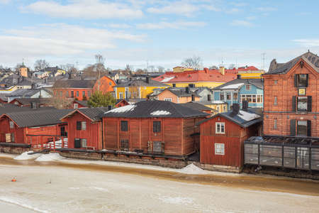 Porvoo, Finland, March 3, 2021. Winter river in Porvoo and surrounding architecture along the banksのeditorial素材