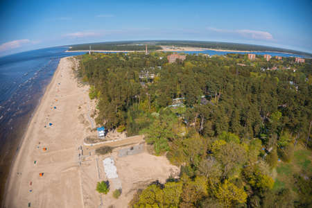 Estonia, narva jÃµesuu, May 26, 2021 Coast of the Gulf of Finland, sandy coast Summer day, drone view of the resort town at the mouth of the Narva in the Baltic Statesの写真素材
