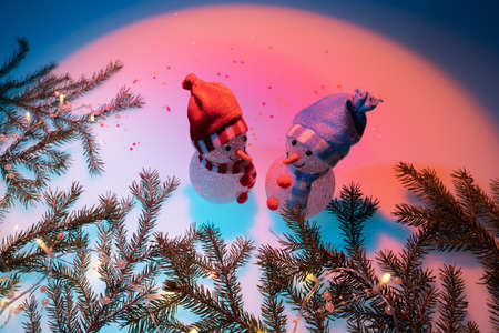 Spruce twigs and Christmas garland, Christmas decorations, There is room for text. Highlighted the light on the background in the form of a circle. Concept, holiday, congratulation.の写真素材