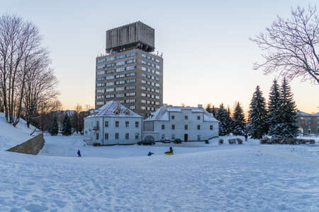 Narva Estonia. December 5, 2021 Children ride a slide. Winter fun.の写真素材