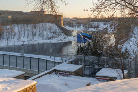 Narva Estonia. December 5, 2021 View of the waving flag of Estonia and Europe, on the border between Estonia and Russiaの写真素材