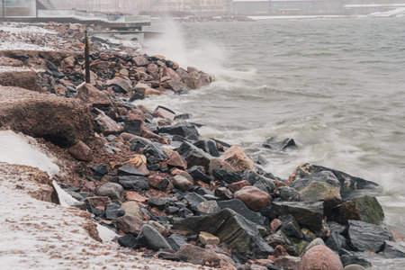 In a storm, sea waves break on the shore. Splash fly. nature of Finland, Scandinaviaの写真素材