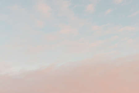 At sunset, blue sky with pink clouds. There is space for textの写真素材