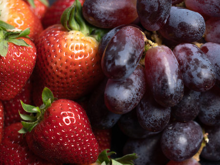 Strawberries and grapes top view. close up. Thesis concept, vitamins