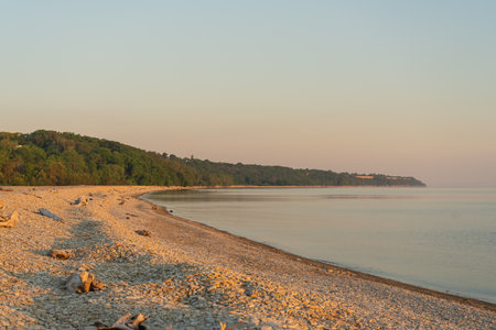 Pebble beach in Toila oru, Estonia. A sunny evening on the coast of the Gulf of Finland. natural background. Space for text.の写真素材