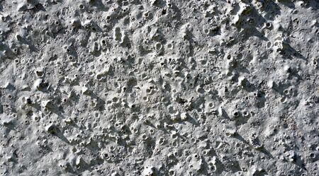 Concrete wall texture like moon surfaceの写真素材