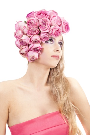 young beautiful woman with pink flowers on her head and in pink dressの写真素材