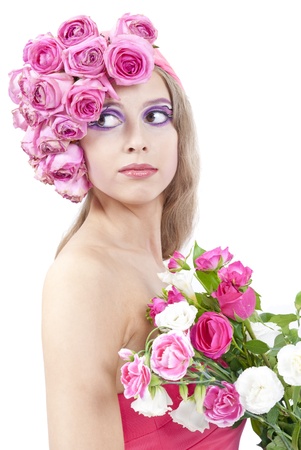 young beautiful woman with pink flowers on her headの写真素材