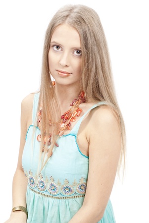 Beautiful woman with flowers in elegant blue sundress over white. Fashion photoの写真素材