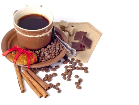 Coffee background with cinnamon, cookies, brown sugar, chocolate and beansの写真素材