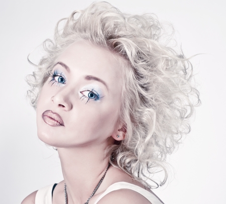 Attractive blond beauty portrait with original make up and hair dressの写真素材